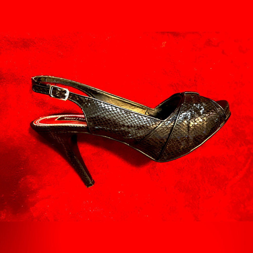 Beautiful Black snake skin heels from White House, Black market 8 1/2 M size.